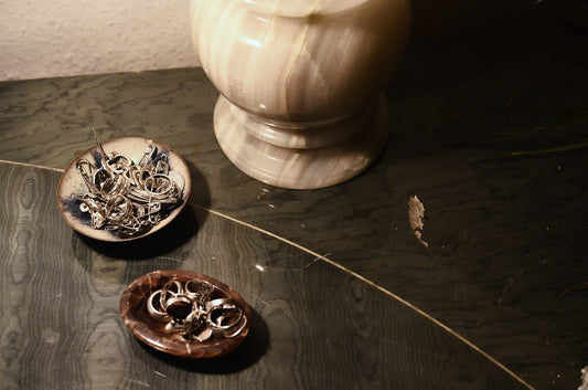 Vase on table with near bowls with accessories